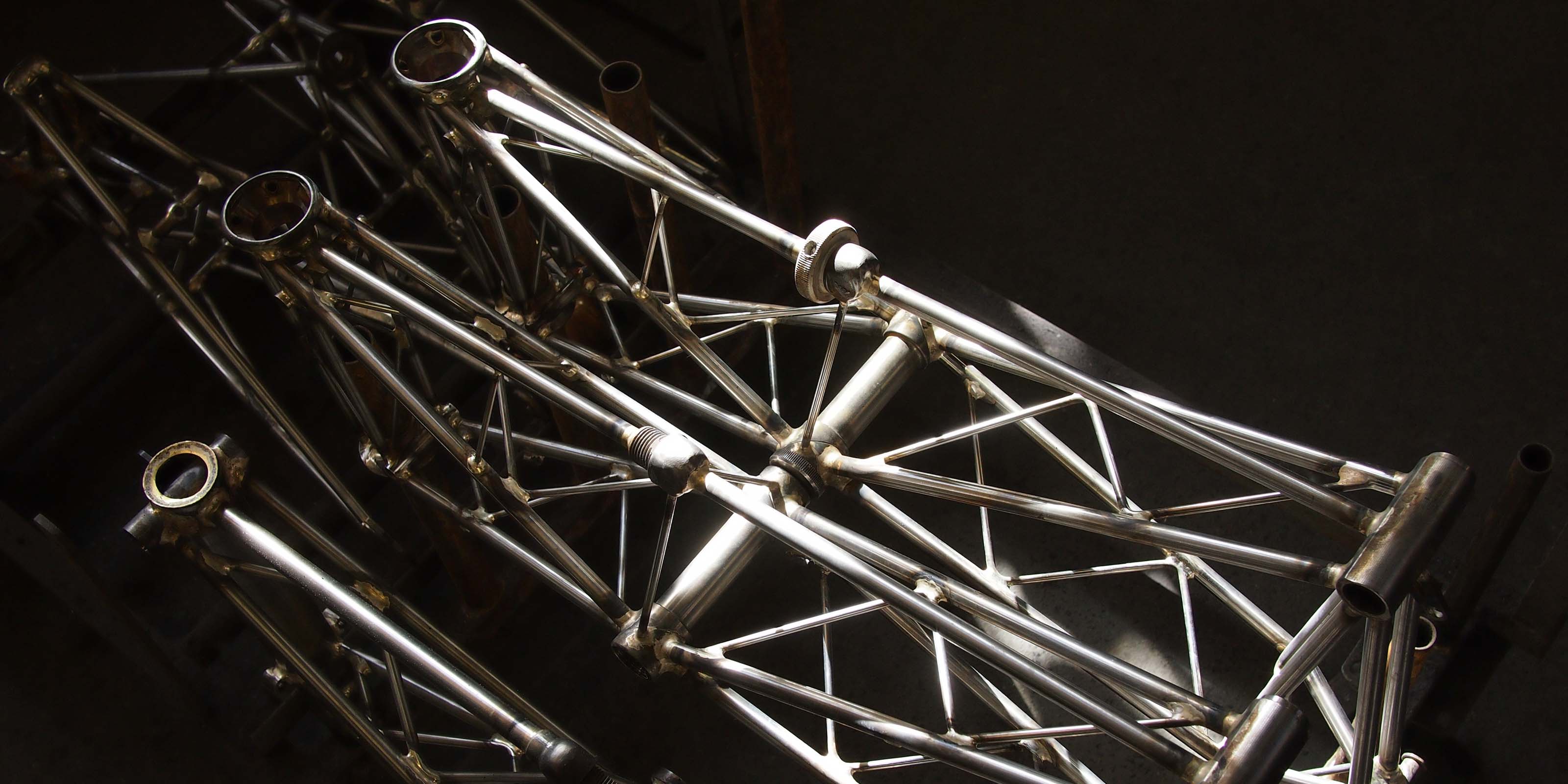 Raw Moulton NS Double-Pylon bicycle frames mid-production in BOA stables workshop